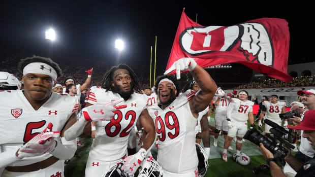 Oct 21, 2023; Los Angeles, California, USA; Utah Utes receiver Landen King (82) and defensive tackle Tevita Fotu (99) celebrate after the game against the Southern California Trojans at United Airlines Field at Los Angeles Memorial Coliseum.